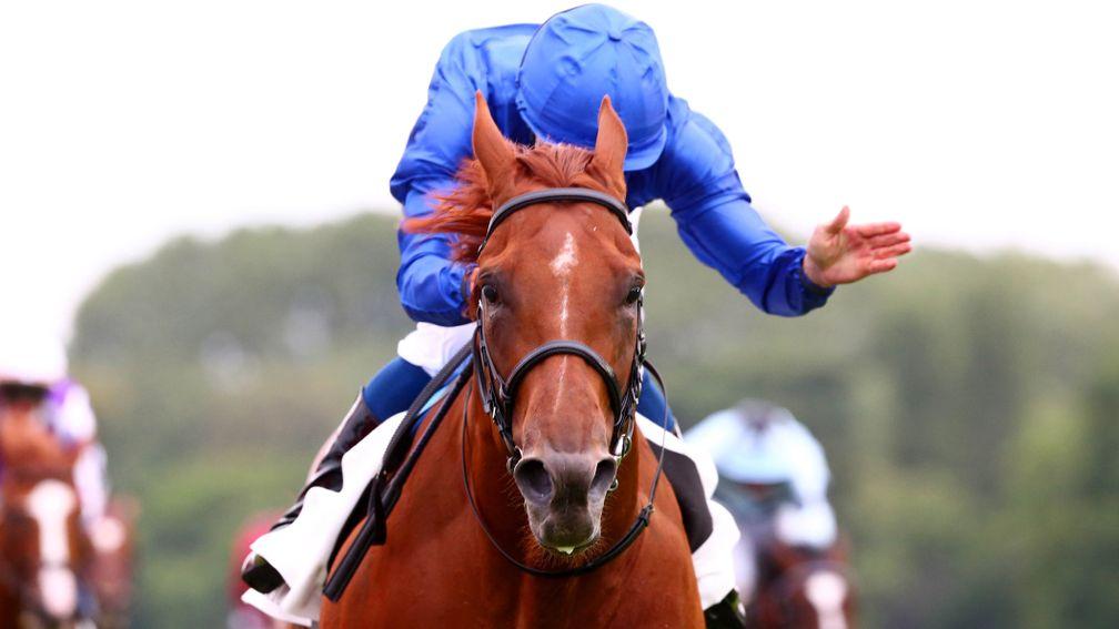 That's my boy! William Buick is delighted with his partner's effort at Longchamp