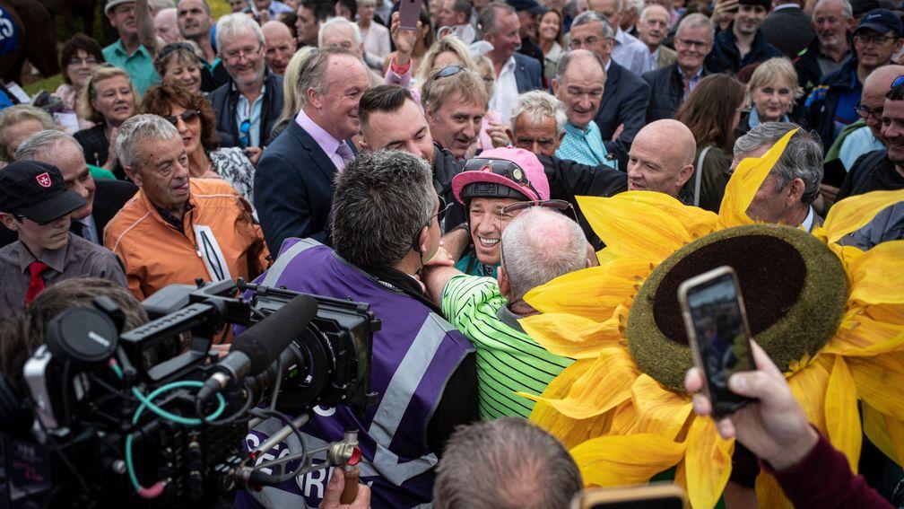Frankie Dettori is mobbed by fans as he heads out for his first ride at Killarney