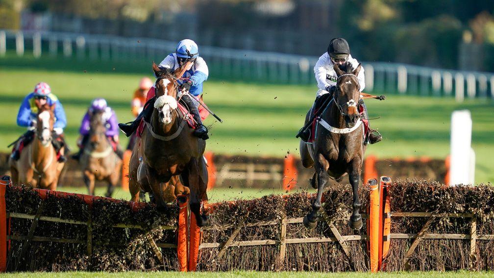 ESHER, ENGLAND - DECEMBER 04: Nico de Boinville riding Constitution Hill (R, white) clear the last to win The Andy Stewart - Sandown Park's Great Friend 'National Hunt' Novices' Hurdle at Sandown Park on December 04, 2021 in Esher, England. (Photo by Alan