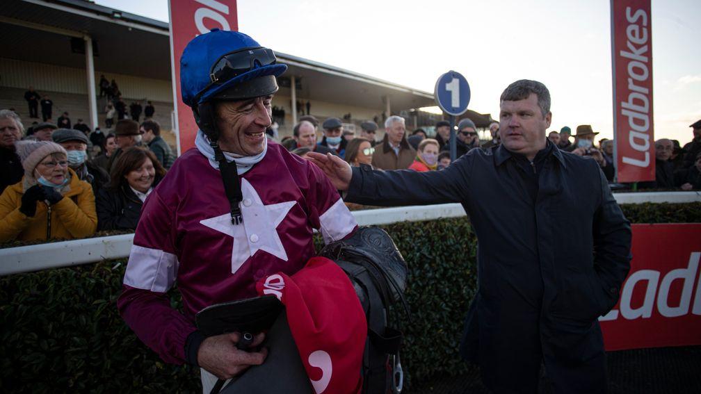 Gordon Elliott gives Davy Russell a pat on the back after Run Wild Fred's win in the Troytown Handicap Chase