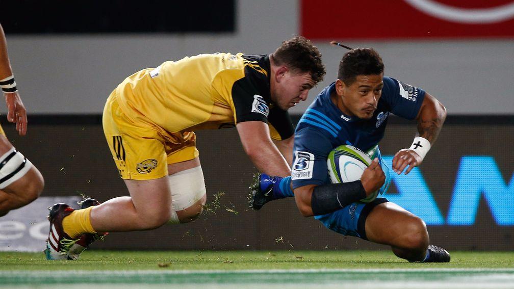 Scrum-half Augustine Pulu scores for the Blues against the Hurricanes