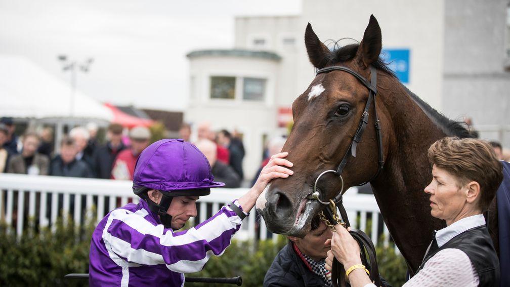Sergei Prokofiev receives an appreciative pat from Ryan Moore after winning the Rochestown Stakes by four lengths