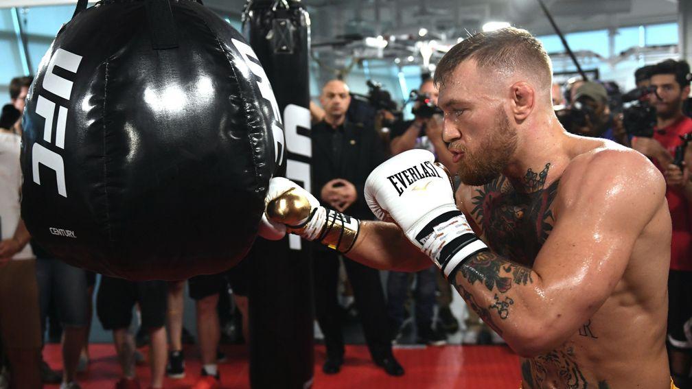 UFC lightweight champion Conor McGregor hits a bag