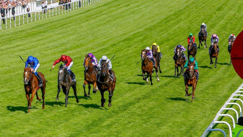 Masar (left) wins the Derby with Roaring Lion (red) third and Saxon Warrior (third left) fourth