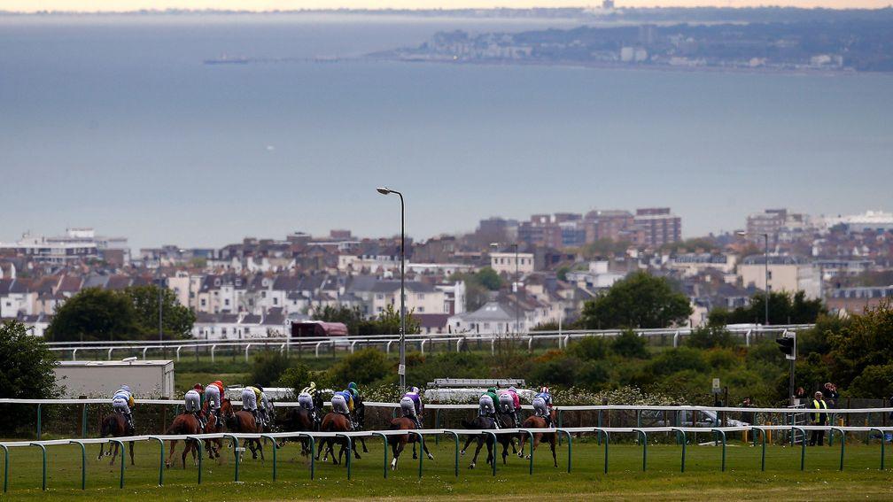 Beside the sea: runners race along the top of the course in the mile handicap at Brighton