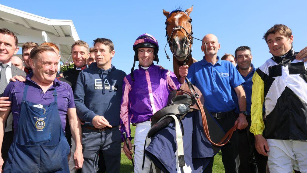 Brian Hughes: congratulated by his weighing room colleagues after riding his 200th winner of the season