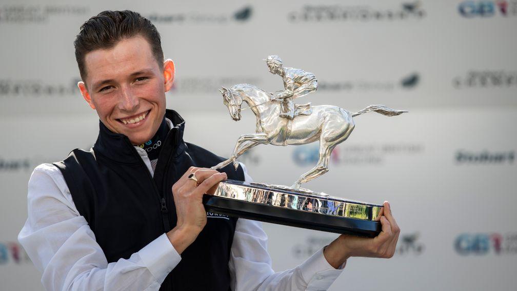Jason Watson with his champion apprentice trophy at Ascot on Saturday