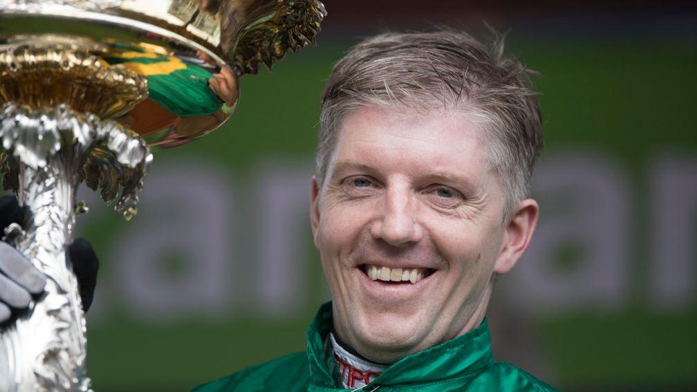 A delighted Noel Fehily displays the silverware after his second Champion Hurdle win