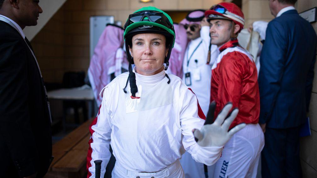 Lisa Allpress walks out of the weighing room before becoming the first female jockey to win a race in Saudi Arabia