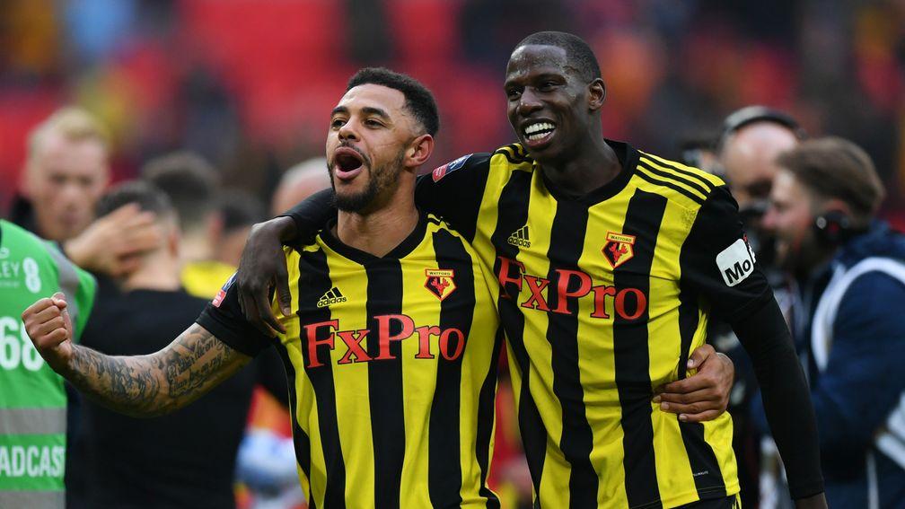 Andre Gray (left) and Abdoulaye Doucoure celebrate Watford’s FA Cup semi-final win