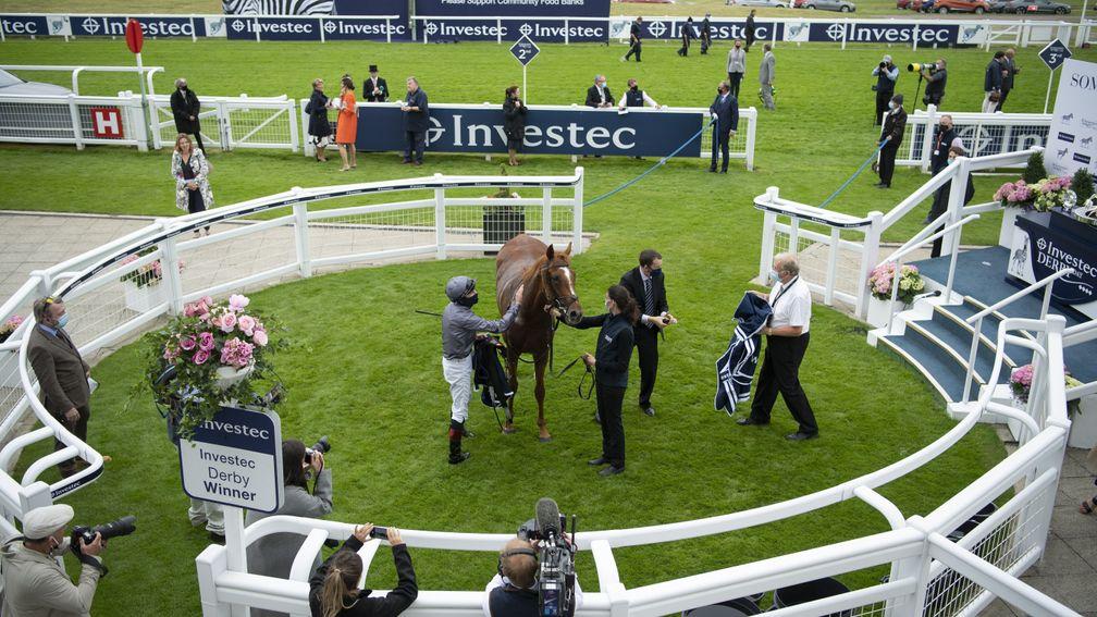 EPSOM, ENGLAND - JULY 04: Serpentine ridden by Emmet McNamara celebrate in the winners circle after the Investec Derby at Epsom Racecourse on July 04, 2020 in Epsom, England. The famous race meeting will be held behind closed doors for the first time due