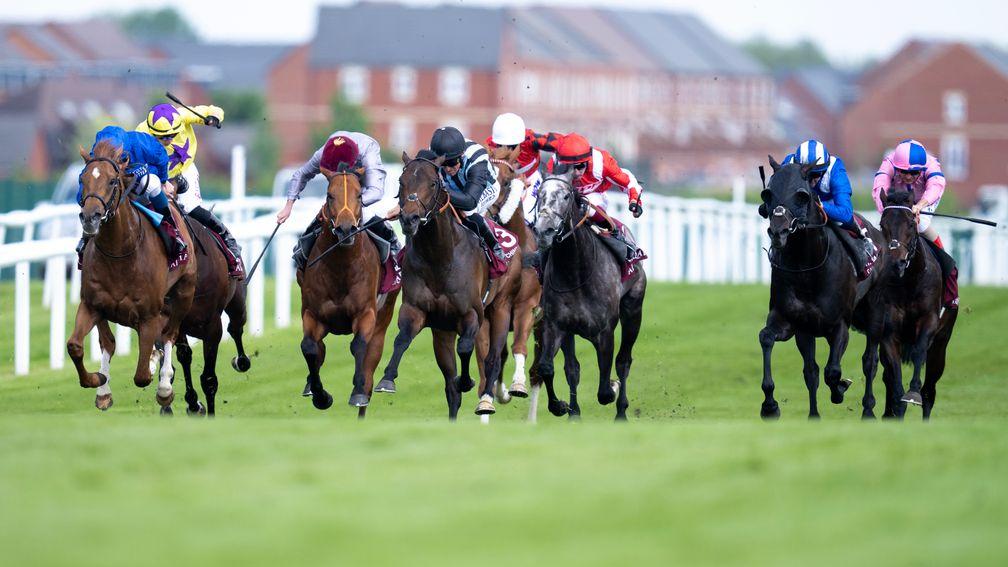 Modern Games (left) goes clear in the Lockinge Stakes at Newbury on Saturday