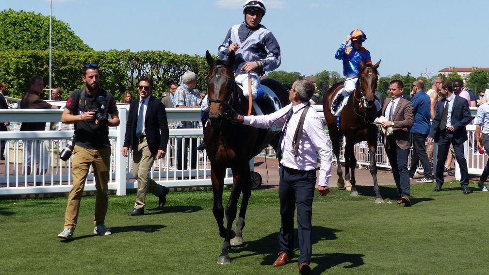 Study Of Man and Stephane Pasquier return to the Saint-Cloud winner's enclosure after landing the Group 2 Prix Greffulhe