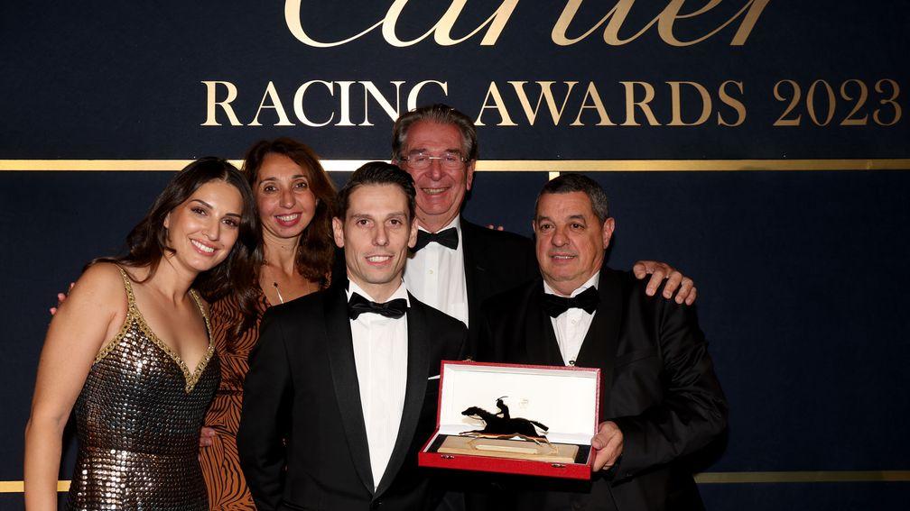 Connections of Ace Impact receive their Cartier Horse of the Year Award, including owner Pauline Chehboub (left), jockey Cristian Demuro and trainer Jean-Claude Rouget (second right)