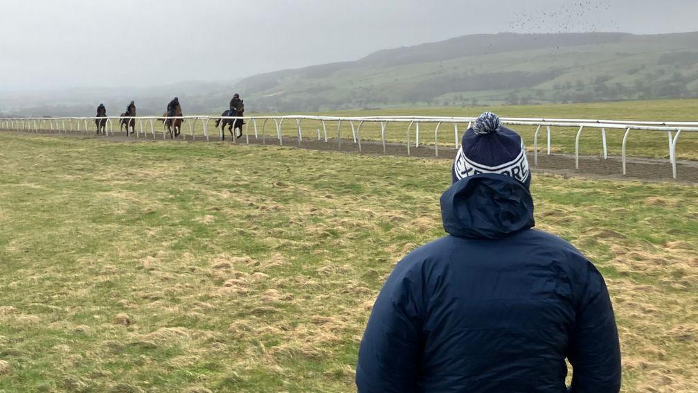Ed Bethell watches two-year-olds exercising on Middleham's Low Moor