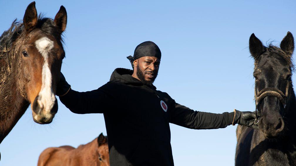 Freedom Tariq otherwise known as Fr33dom the founder of The Urban Equestrian Academy in the paddock with  his horses at Scraptoft Hill Farm near Leicester 15.12.20Pic: Edward Whitaker
