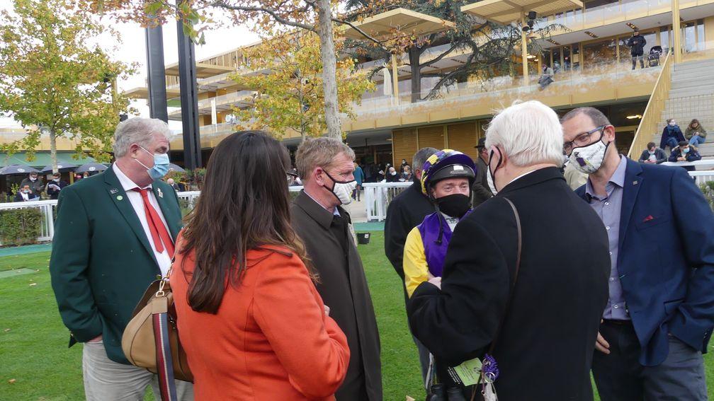 Tony Mullins and Seamie Heffernan discuss tactics with the owners of Princess Zoe ahead of the Prix Royal-Oak