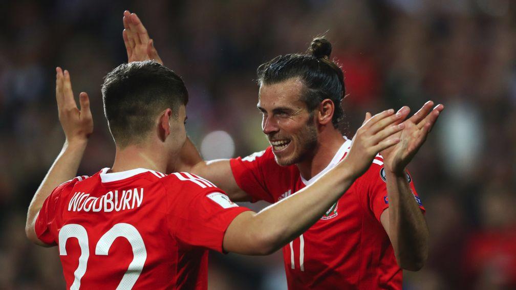 Ben Woodburn celebrates scoring against Austria with Gareth Bale