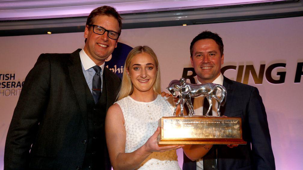 Jessica McLernon receives her trophy from Ed Chamberlin and Michael Owen