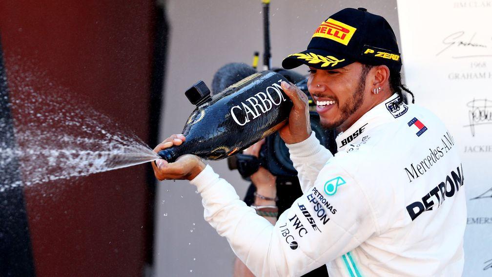 Lewis Hamilton celebrates after winning in Spain - his third victory of the season