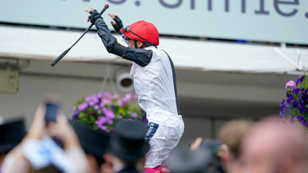 Frankie flies above the top hats in the winner's enclosure following his win on Megallan in the Diomed Stakes
