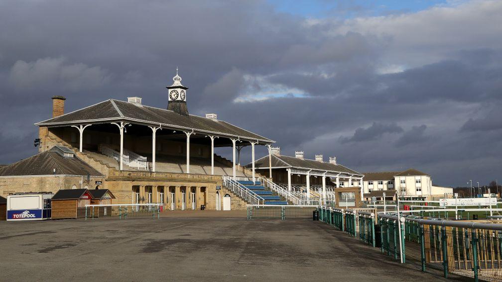 Storm clouds over an empty Doncaster on Thursday summing up a difficult day for racing