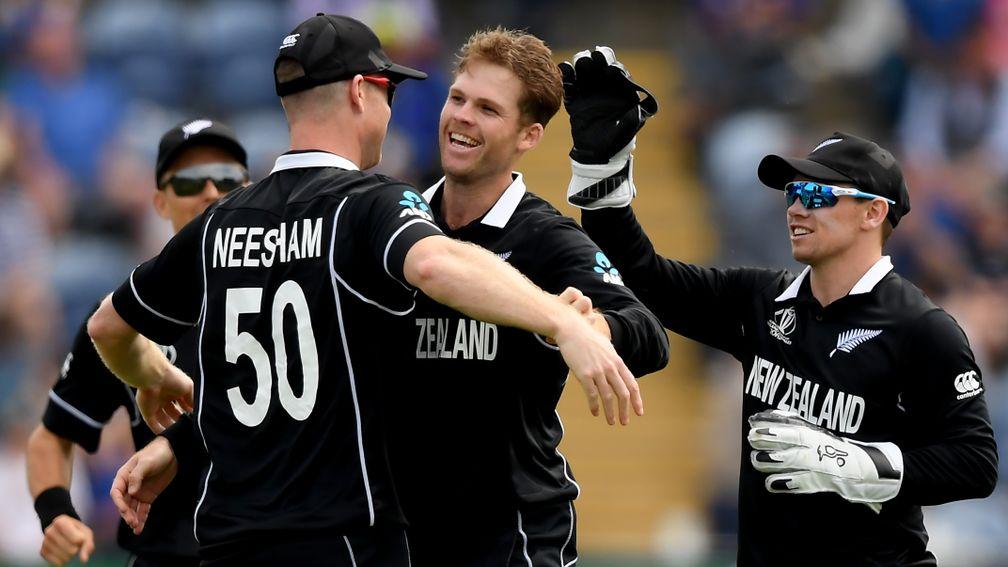 Lockie Ferguson (centre) of New Zealand celebrates a wicket against Sri Lanka