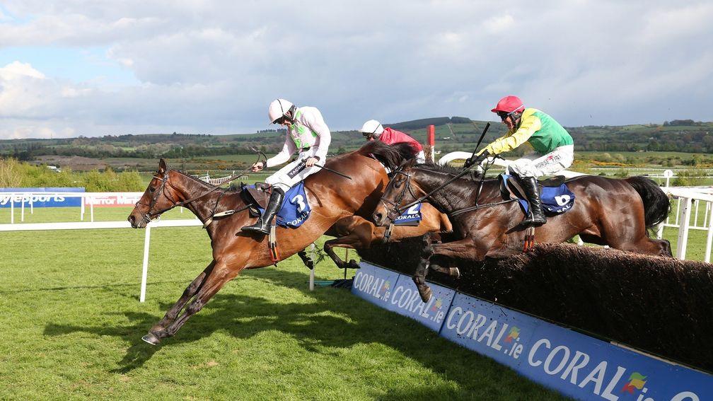Djakadam leads Sizing John over the last in the Punchestown Gold Cup