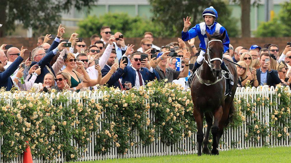 Hugh Bowman celebrates after winning the George Ryder Stakes on Winx