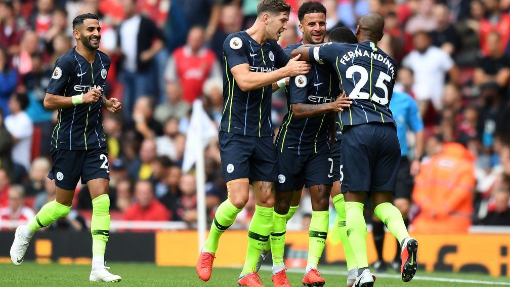 Manchester Ciity celebrate Raheem Sterling's opener at Arsenal