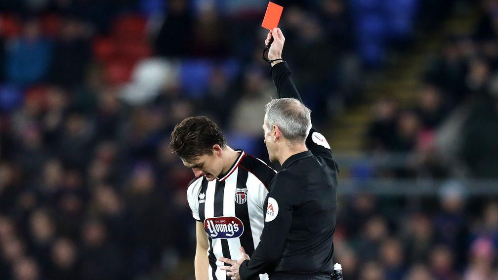 Andrew Fox of Grimsby is sent off by referee Mark Atkinson
