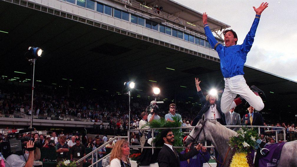 Frankie Dettori performs his traditional flying dismount after winning the 1999 Breeders' Cup Turf at Gulfstream Park on Daylami