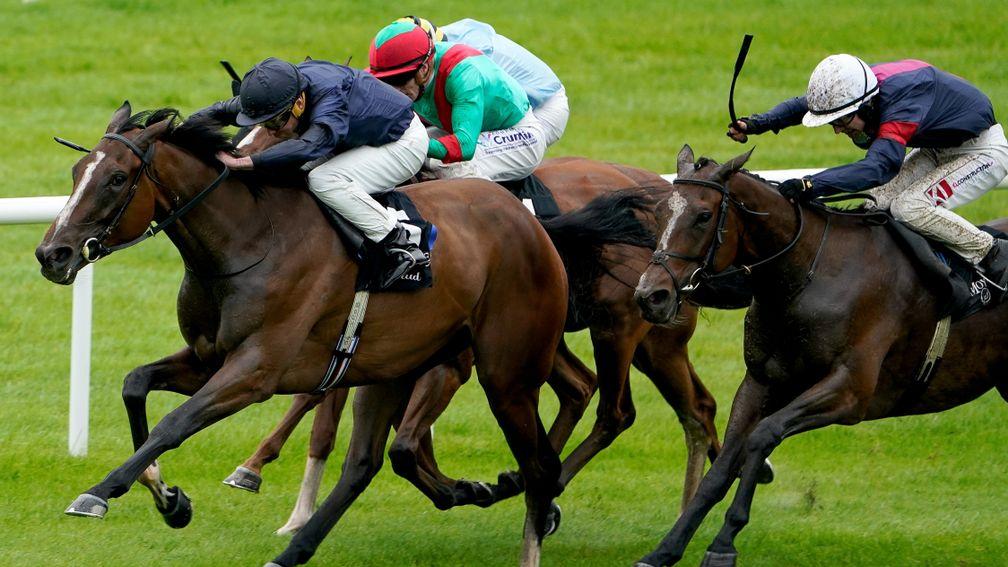 KILDARE, IRELAND - SEPTEMBER 11: Ryan Moore riding Above The Curve (dark blue) win The Moyglare 'Jewels' Blandford Stakes at Curragh Racecourse on September 11, 2022 in Kildare, Ireland. (Photo by Alan Crowhurst/Getty Images)