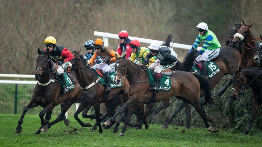 Left hand down... Ultragold and Haryy Cobden (yellow cap) lead the field over the Canal Turn on their way to a second win in the Topham Trophy
