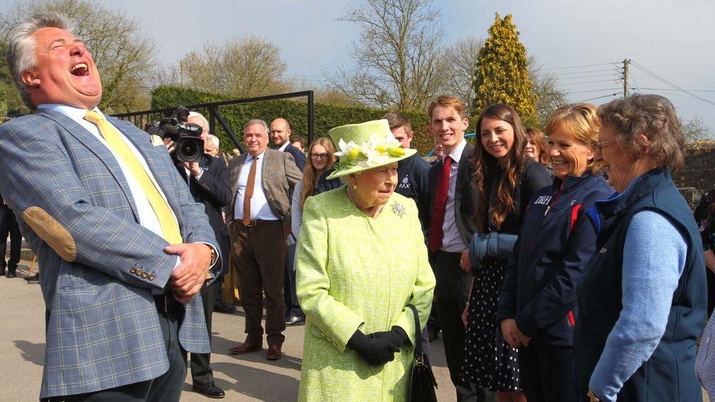 The Queen jokes with Ditcheat team members during her visit, including Bryony Frost (third right)