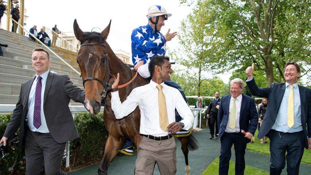 Teppal returns to the winner's enclosure after Classic victory at Longchamp