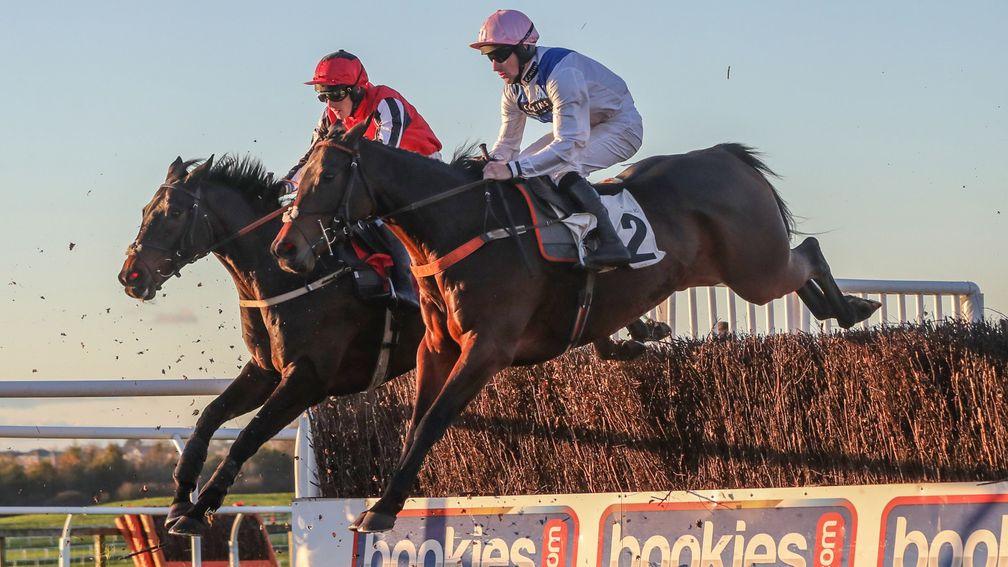Waiting Patiently and Brian Hughes (nearside) jump an early fence in unison with Baywing on his way to a successful reappearance at Carlisle