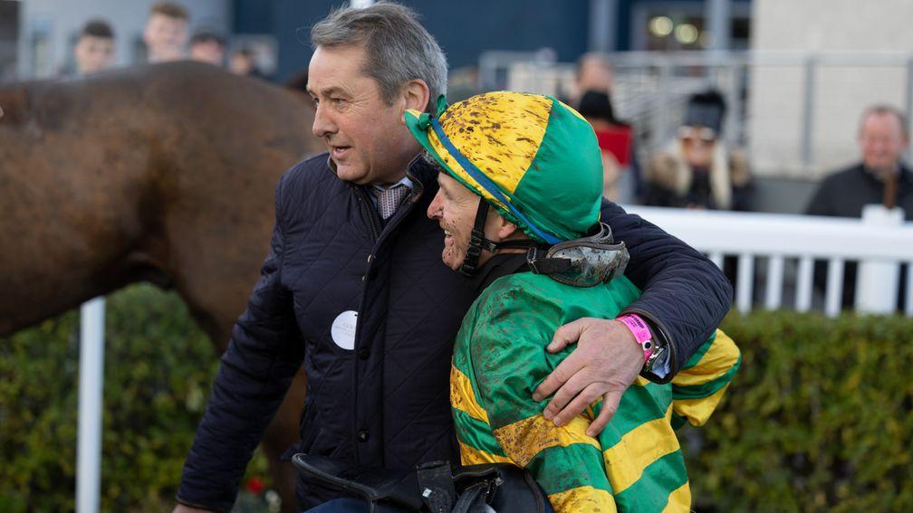 Well done, mate: jockey Niall McCullagh gets a hug from Pat Fahy