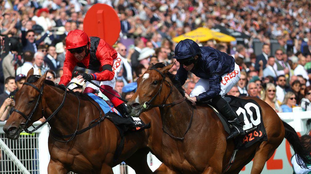 Ryan Moore and Tuesday (right) go past the post with Emily Upjohn (left) in a thrilling Cazoo Oaks