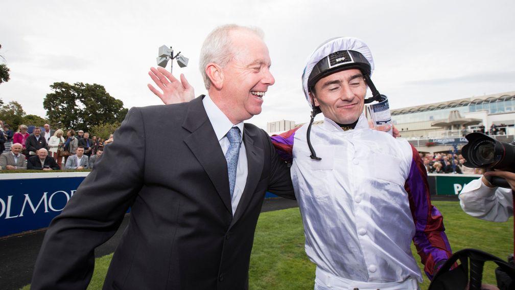 Danny Tudhope, pictured with trainer Karl Burke, is 33 today