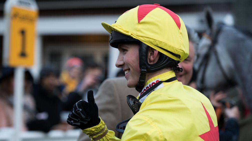 Huge day: young jockey Harry Cobden is all smiles after winning on Politologue