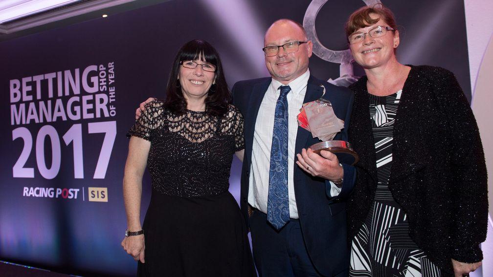 Betting Shop Manager Of The Year 2017 Ron Hearn of Jenningsbet celebrates his win with his wife Julie (right) and Dawn Shepherd (shop assistant) in the 30th anniversary of the awardsCarlton Towers Hotel, London 20.11.17 Pic: Edward Whitaker