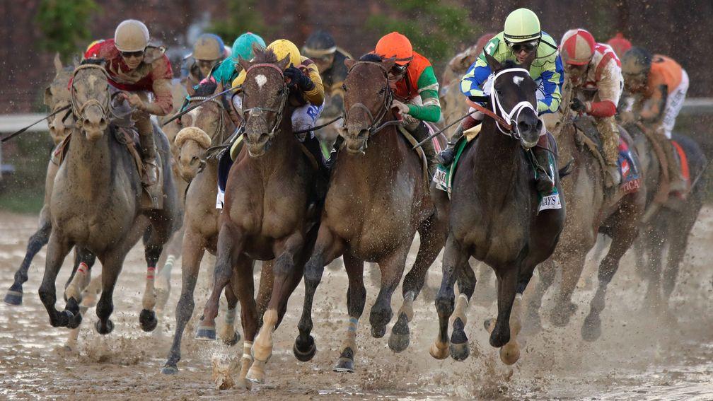 Always Dreaming (right) leads the field into the stretch during the Kentucky Derby