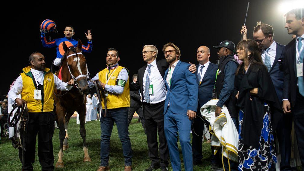 Jason Servis (fourth from the left) celebrates Maximum Security's victory in the Saudi Cup