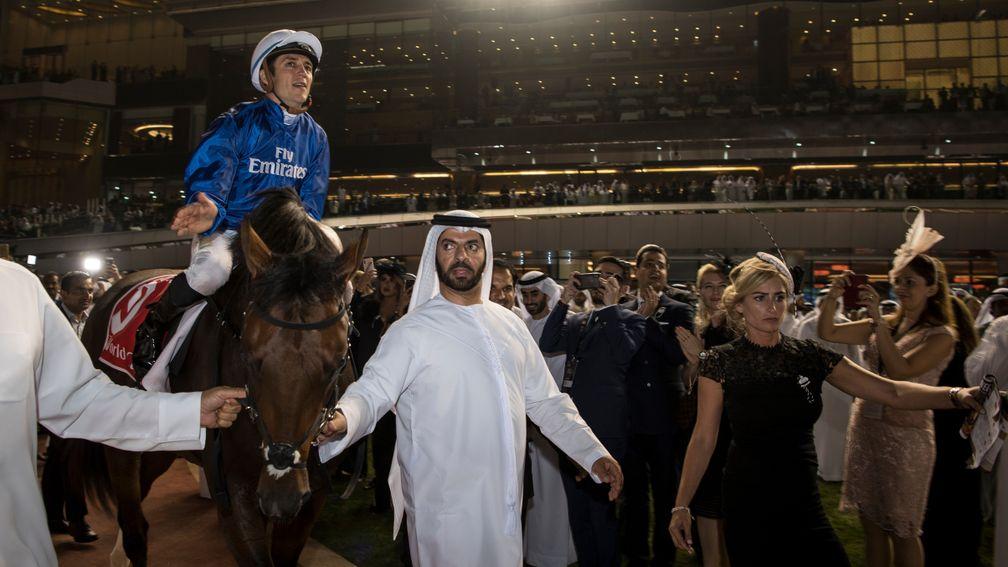Saeed bin Suroor leads Thunder Snow and Christophe Soumillon in after winning the Dubai World Cup
