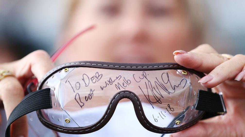 Winning view: a racing fan at Flemington shows off the goggles given to her by Melbourne Cup-winning jockey Kerrin McEvoy