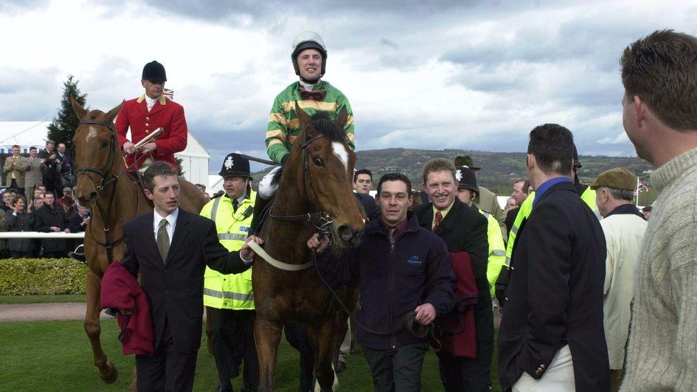 Charlie Swan and Istabraq are led in after winning the Champion Hurdle at Cheltenham in 2000