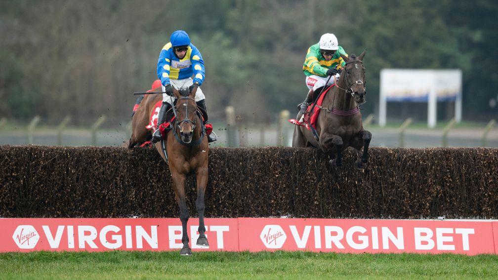 Sporting John (Richard Johnson,right) jumps the last fence and beats Shan Blue (Harry Skelton) in the Scilly Isles Novices' ChaseSandown 6.2.21 Pic: Edward Whitaker/Racing Post