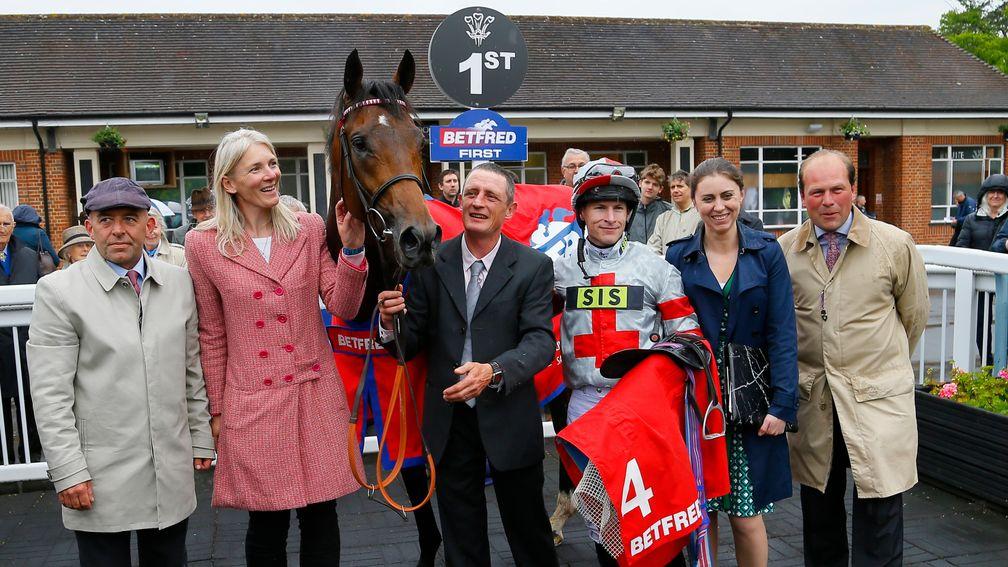 Knight To Behold and connections celebrate victory in the Lingfield Derby Trial