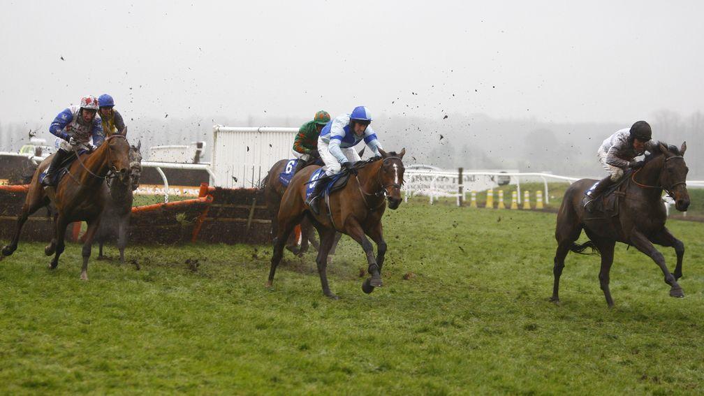 Reve De Sivola (left) before reeling in the leaders in the Challow Novices' Hurdle at Newbury